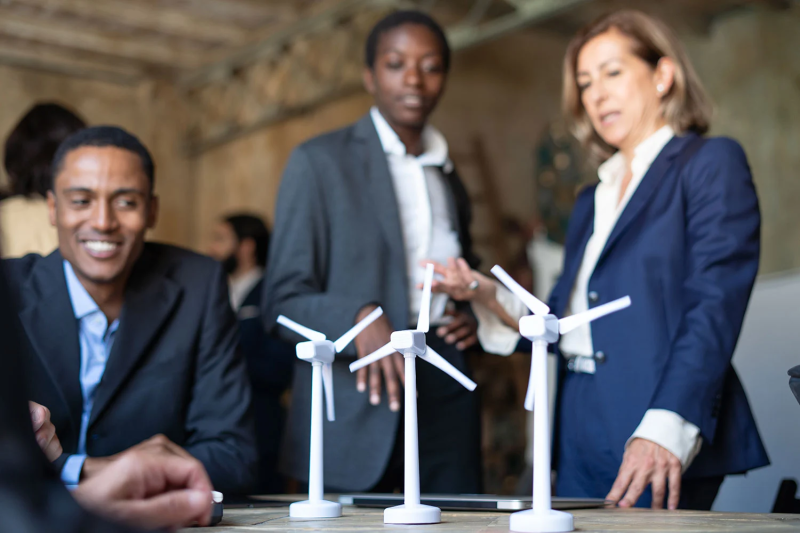 engineers-team-discussing-about-a-wind-power-plant-project engineers-team-discussing-about-a-wind-power-plant-project