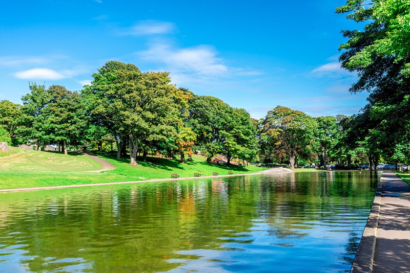 A long pond and an alley in Duthie park near the entrance, Aberdeen, Scotland