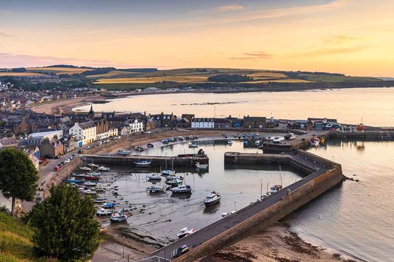 Stonehaven harbour at sunrise. Stonehaven is a picturesque harbo