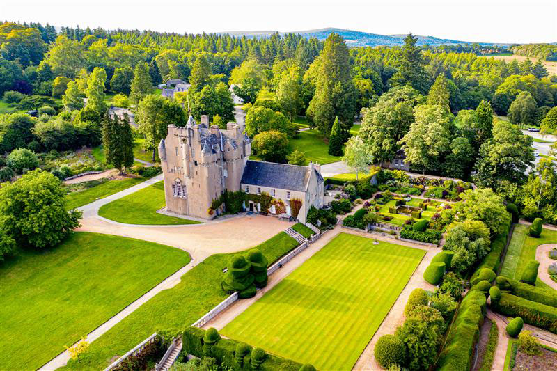 Crathes Castle-front-of-castle,-croquet-lawn-and-main-lawn